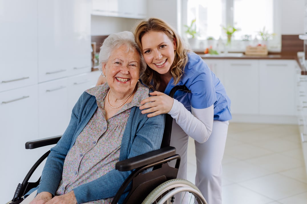 Disabled Elderly Woman and Her Caregiver